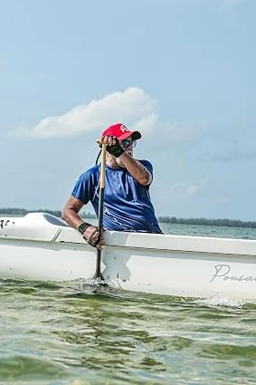 Jorge Luiz Ferreira Dias, the author, paddling an outrigger canoe